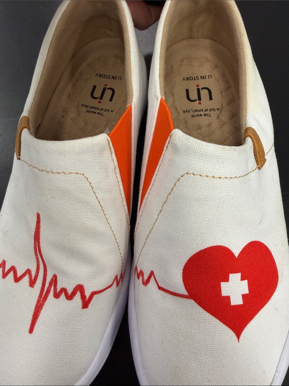 UIN White Canvas Slip-Ons with Red Heart Graphic if you’re a nurse or know one!